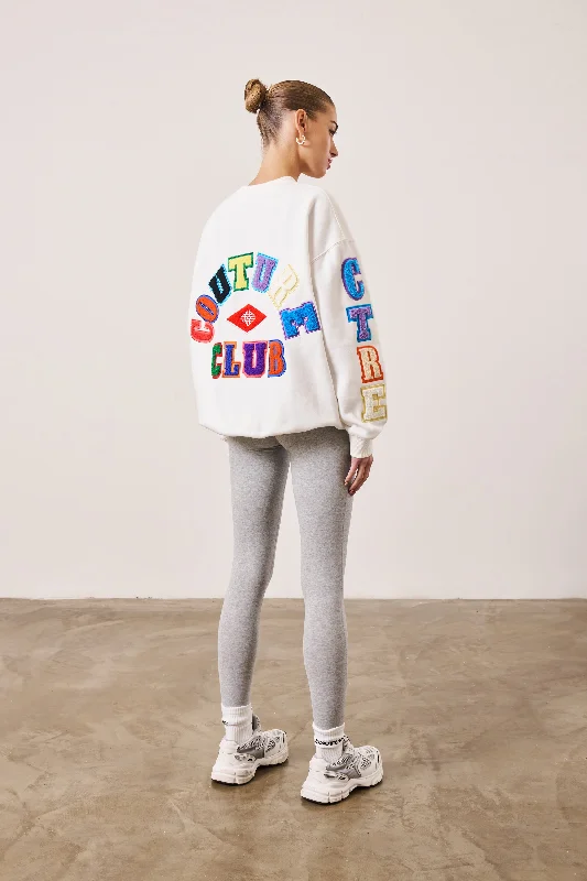 MULTIBADGED CHENILLE RELAXED SWEATSHIRT - OFF WHITE